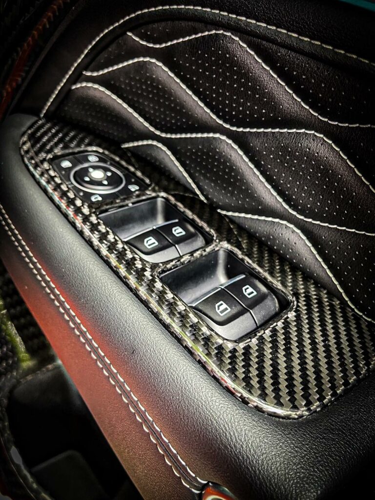 Custom door panel crafted from premium carbon fiber materials.